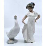 A pair of Nao figures including a young girl and a goose. Height of girl approx 21.5cm , height of