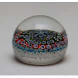 A millefiore glass paperweight, in the manner of Clichy, diameter approximately 8cm, height
