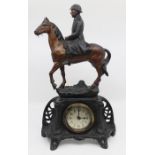 An early 20th Century mantle clock with spelter figure of French soldier on horseback, approx 44 cms