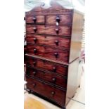 A Victorian mahogany chest on chest, circa 1860, swan neck cornice above two short and six long