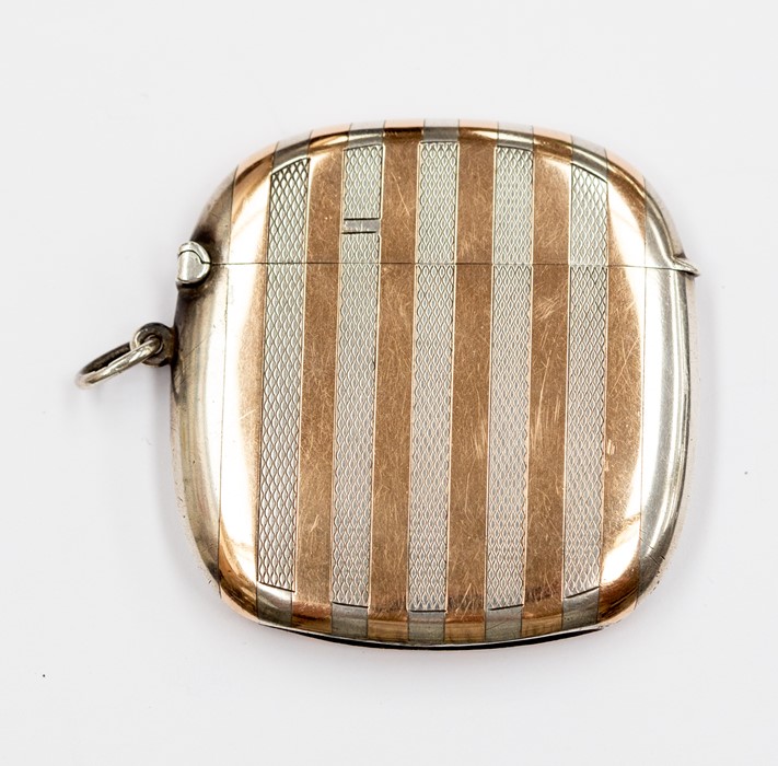 A George V silver and gold vesta case, engine turned and plain striated pattern, by Sampson Mordan &