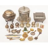 A collection of metal ware to include; an EPNS biscuit box, a spoon warmer, Britannia metal,