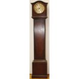 A George V oak eight day grand daughter clock, having a silvered dial with Arabic numerals, three