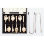 A cased set of six Sheffield silver teaspoons, two George IV sugar tongues, approx 3.95ozt gross