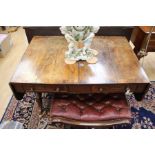 A George III mahogany and walnut sofa table with two drawers to one side and two faux drawers to