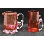 Two cream jugs, cranberry glass, 19th Century