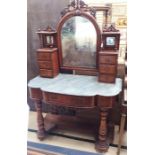 A mid Victorian mahogany marble topped dressing table, arched mirror with carved crest rail, six