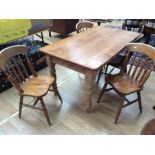 A Victorian pine kitchen table, raised on turned legs, 76cm high, 152cm wide, 86cm deep, together