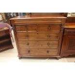 A mid Victorian mahogany chest of drawers, comprising frieze drawer to top, with two short over