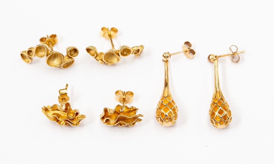 Three pairs of 9ct gold earrings, to include a drop honeycomb version, multi circle row and an