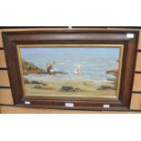 An early 20th Century oil on canvas of two Edwardian children playing in the sea, signed MY