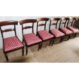 A set of six Victorian bar-back mahogany dining chairs, drop-in seats, raised on turned legs, red