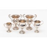 A pair of modern silver two handled small trophies, Birmingham, 1956 together with three further