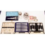 A collection of boxed plated flatware, including set of golfing teaspoons, and glass jars