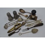 A collection of metal ware to include a; steel fork, bronze ware, stamp, nutcrackers, German cruet