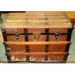 A late 19th Century Dome topped wooden trunk, the lid opening to reveal removable shelf, 64cm
