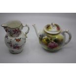 A Royal Worcester bullet shaped teapot and cover decorated with roses, (crack to cover), puce mark