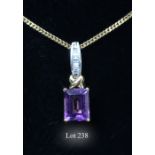 An 18ct amethyst and diamond pendant and 18ct chain, the rectangular step cut amethyst, in four claw