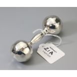 Tiffany. A silver rattle in the form of a dumbbell with textured terminals, signed Tiffany and Co ''