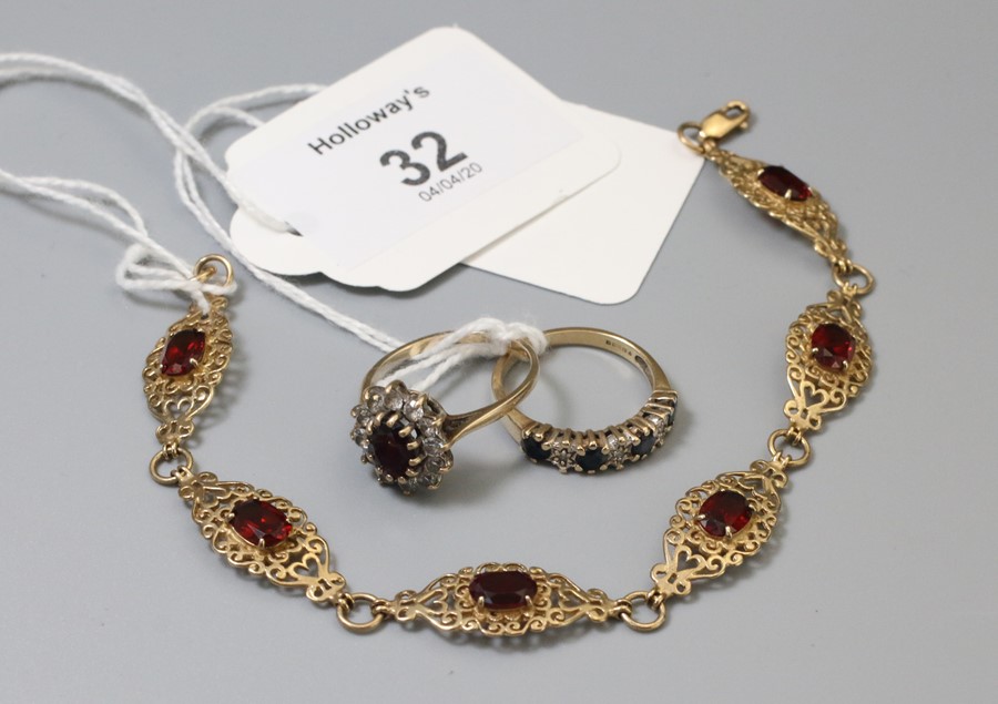 A sapphire and diamond seven stone half hoop ring, a seven stone garnet line bracelet and a cluster