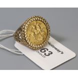A sovereign ring, the sovereign dated 1966, to a pierced and engraved 9ct gold mount, 15.3g