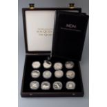 A silver commemorative twelve piece coin collection, to commemorate H M Queen Elizabeth, the Queen M