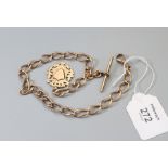 An Edwardian rose gold open curb pattern watch chain and suspensory medal, with vacant shield shaped