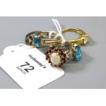 An opal and ruby cluster ring, to 9ct gold mount,a blue topaz and diamond seven stone half hoop ring