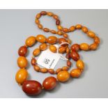 An amber bead necklace, the single strand of amber beads approximately 0.6cm to 3.3cm in length, tot