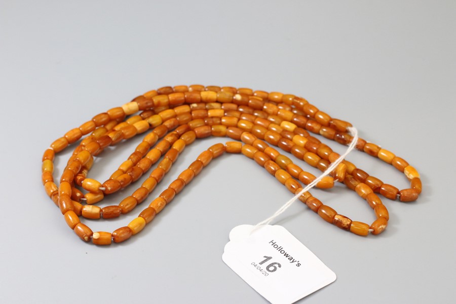 An amber bead long chain of small oblong beads, vari-coloured, approximately 156cm length gross weig