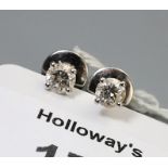 A pair of single stone diamond earrings, the brilliant cut diamonds in four claw mounts, with screw