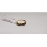 A late Victorian five stone half hoop diamond ring, the slightly graduated brilliant cut diamonds in