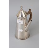 An early 20th century silver conical cafe au lait pot, with urn finial and pear wood handle, Sheffie