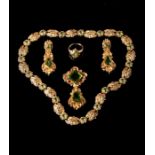 A mid Victorian gold and peridot demi-parure, comprising a necklace, brooch, earrings and ring, the