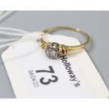A single stone diamond ring, the brilliant cut diamond in illusion mount, to plain 18ct gold shank,