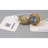 A single stone blue topaz ring, in pierced and carved foliate mount, together with a pierced abstrac
