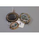 A Victorian enamel turquoise and agate oval brooch, with applied floral motif to oval agate within a