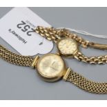 A lady's 9ct gold Vicence wristwatch, circular dial with baton numerals and herringbone bracelet ma