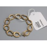 A 9ct gold horseshoe link bracelet, 29cm length 10.7g