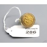 A half sovereign ring, the sovereign dated 1905, in 9ct gold ring mount. Ring size S, 9.7g