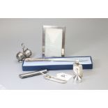 Tiffany. A silver Tiffany photo frame, plain rectangular, 11.5 x 8cm, together with a safety pin key
