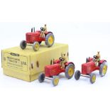 Dinky: A trade box, Dinky Toys, comprising three, 27A, Massey-Harris Tractor, red body with