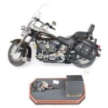 Franklin Mint: A Harley Davidson Softail 1:10 scale motorcycle, some parts loose, together with