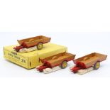 Dinky: A trade box, Dinky Toys, comprising three, 27B, Harvest Trailer, tan and red body, vehicles