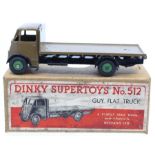 Dinky: A boxed, Dinky Supertoys, Guy Flat Truck, 512, dark brown cab and body, green hubs, slight