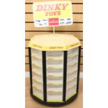 Dinky: A Dinky Toys by Meccano, shop display stand, comprising 48 compartments, upon rotating stand,
