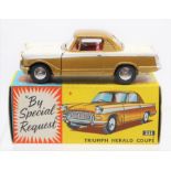 Corgi: A boxed, Corgi Toys, Triumph Herald Coupe, 231, white and gold body, red interior.