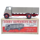 Dinky: A boxed, Dinky Supertoys, Guy 4-Ton Lorry, 511, fawn and red cab and body, slight paint