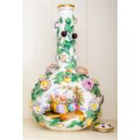 A pair of Dresden porcelain flower-encrusted bottle vases and covers,