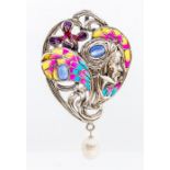 A plique a jour silver and enamel brooch in the form an Art Nouveau style figure, set with  oval